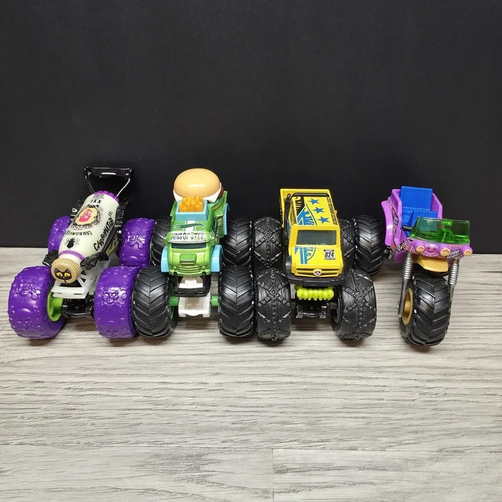 Hotwheels Monster Trucks Lot - Carbonator, Buns Of Steel, Unimog, And Tuk N Roll
